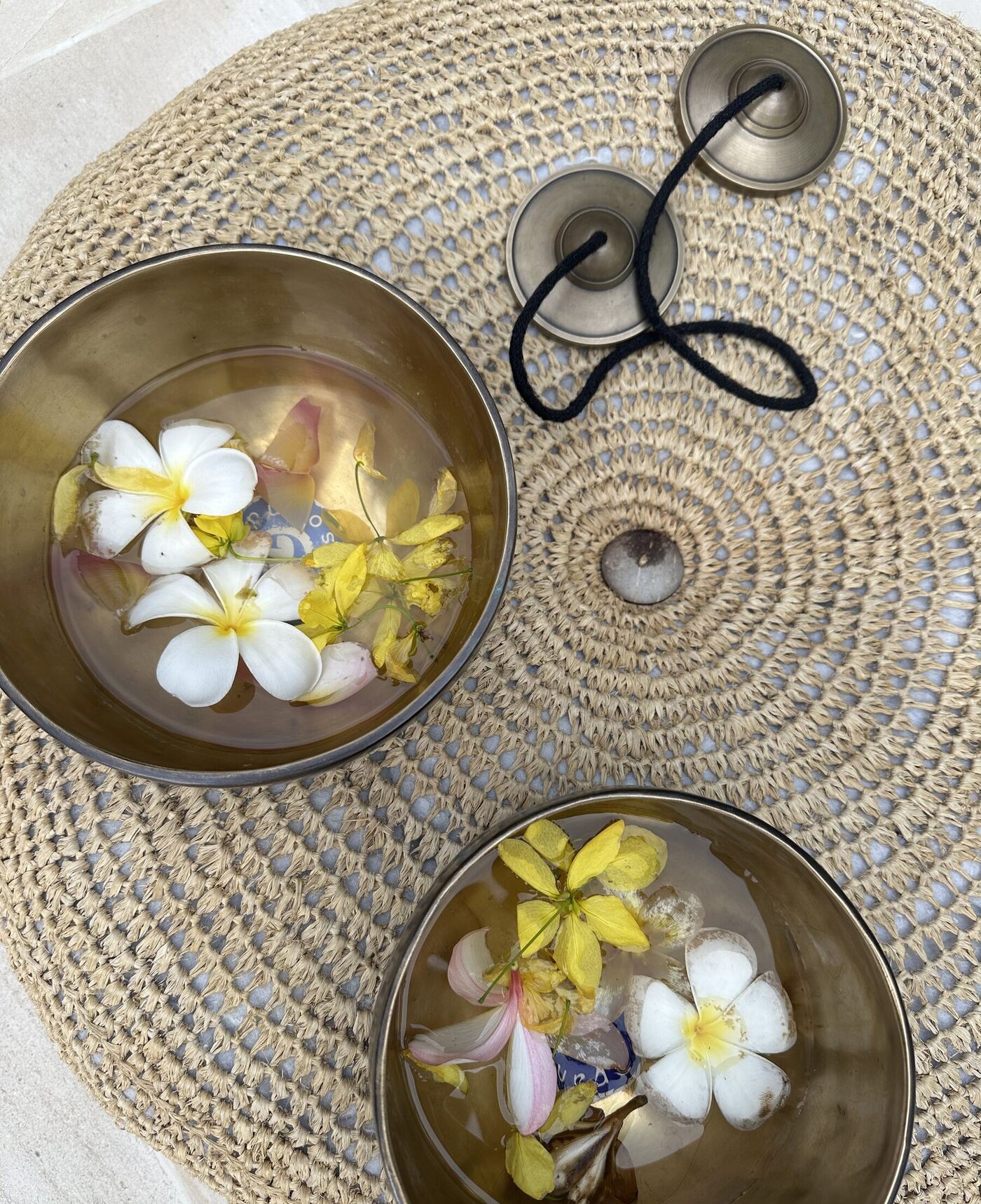 Kate teaching Tibetan singing bowl technique to a student