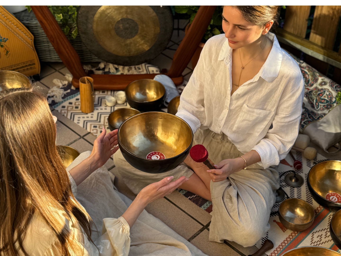 Learning to play Tibetan singing bowls on a hidden rooftop in Central, Hong Kong